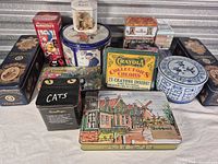 Group shot of all tins displaying fronts and shapes