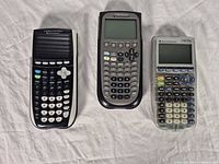 Front view of three calculators showing model layouts
