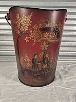 front view showing painted chinoiserie figures and floral motifs on red bucket