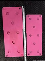 Adult and junior FlipFold boards side by side with measuring stick