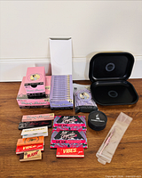 Overall view of rolling papers, trays, grinder, and accessories