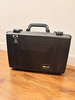 Front view of closed Pelican 1490 case showing latches, handle, logo badge