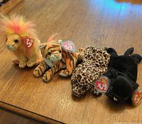 Group shot of all four Ty Beanie Babies big cats lined up on table