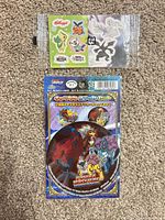 Both sealed sticker packages displayed on carpet