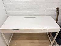 Front view of closed white desk
