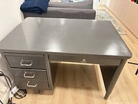 Top and front view showing overall desk, drawers closed