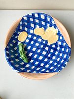 Top view showing gingham interior, potato chip motifs, cucumber dip holder