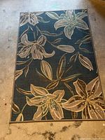 Full view of the floral area rug showing overall pattern and size