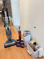 Full lot with vacuum, solutions, plunger, bin, caddy and contents