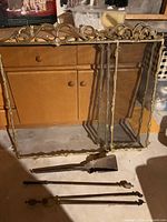 Screen, three tool rods, detached shovel blade on floor