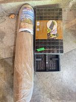 Rolled burlap and 84-cell plug tray side by side
