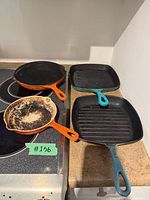 Overview of four cast iron pieces on stovetop