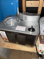 Front view showing stainless steel body, vent, lid, control knob and power cord