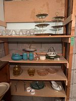 Overall view of shelving with all glassware and ceramics