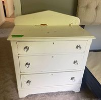 front view of white 3-drawer dresser
