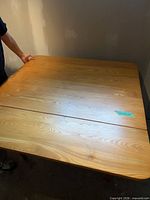 Top view of solid wood drop-leaf table fully extended