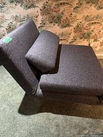 Lounge chair in folded position showing side profile and bolster