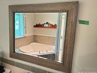 Frontal view of rectangular mirror showing frame and reflection