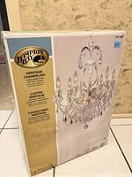 Front of sealed Hampton Bay Heritage chandelier box showing product image, brand, dimensions, finish