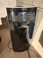 Front view of black Bionaire tower humidifier showing control panel and water fill opening