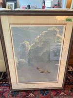 Full view of framed print under glass