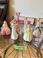 All six figurines arranged on table