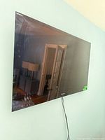 Front view of wall-mounted Sony Bravia television showing screen and bezel