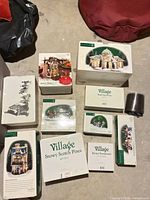 All boxed Department 56 Village items laid out on floor