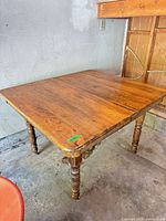 Full view of wooden extendable table top and legs