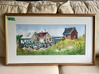 Full view of framed watercolour painting on couch