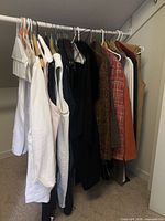 Rack of assorted women’s garments on hangers