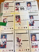 Backs of several cards with player data and numbering