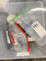 Top view of tote showing mix of Echo Dots and call bells in zip bag