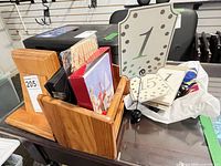 Overall lot showing bookends, letter holder, table number signs