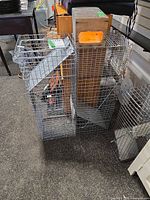 Group of three wire mesh cage traps standing upright