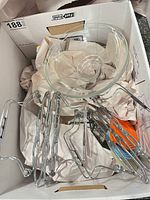 Glass bowls and wire trivets inside box