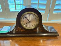 Front view of Sessions tambour mantel clock showing dial, bezel, and case