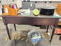 Full view of table top, legs, drawers