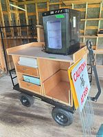 Overall view of wagon with incubator and signs