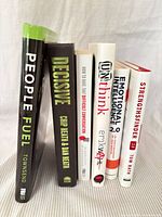 Spine view of all six books standing