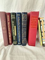 Front spines of eight books standing