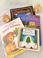 All four books and two wooden puzzles grouped