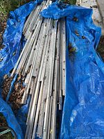 Aluminum frame extrusions on tarp