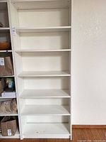 Front view of white Billy bookcase showing six shelf levels