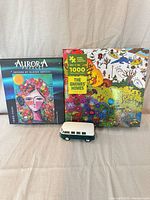 Group shot of two puzzle boxes and VW bus model