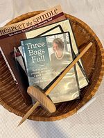 Spindle, book, Three Bags Full DVD and basket overview