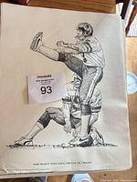 Print of Mark Moseley kicking with caption