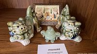 Whole lot showing both Foo Dogs, green stone censer and inlaid wood box