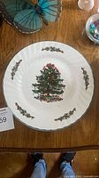 Front view of plate showing Christmas tree and holly decoration