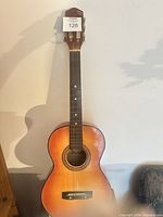Front view of guitar showing body, neck, rosette, bridge